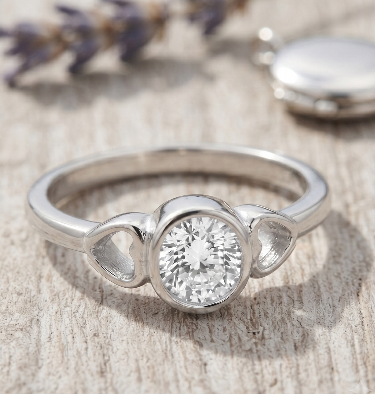 Silver Bezel Ring with Heart Motifs